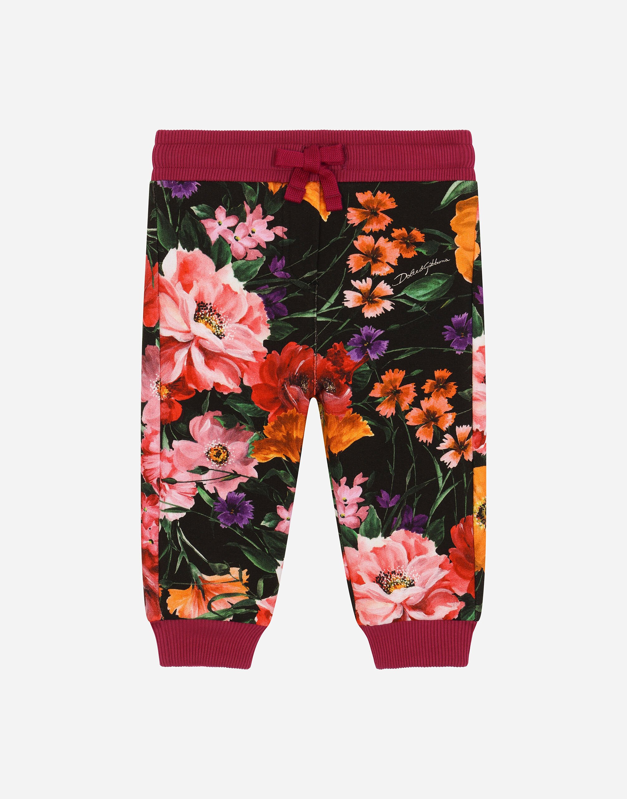 ${brand} Jersey jogging pants with floral print over a black background ${colorDescription} ${masterID}