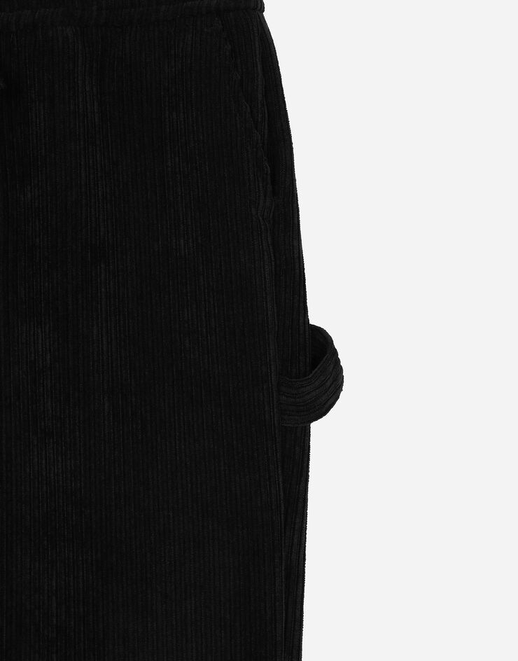 Dolce & Gabbana Pantalon en velours côtelé avec plaquette à logo Noir L44P65FUWDL