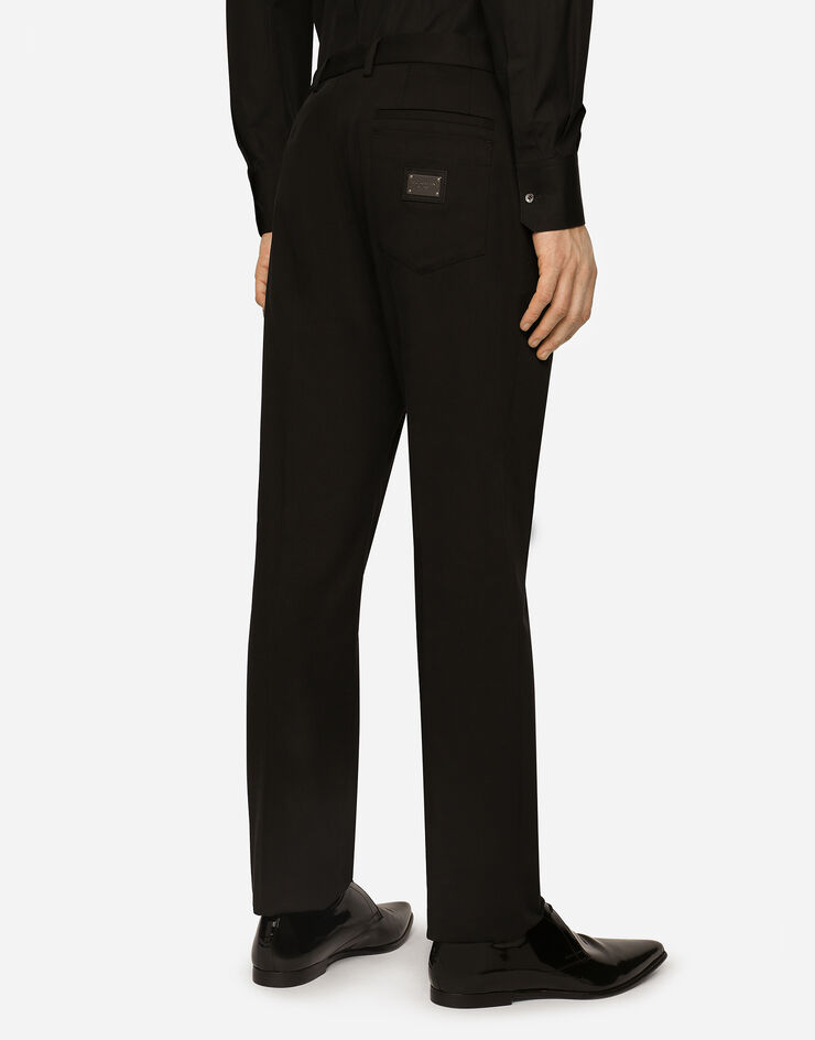 Stretch cotton pants with branded tag in Black for Men | Dolce&Gabbana®