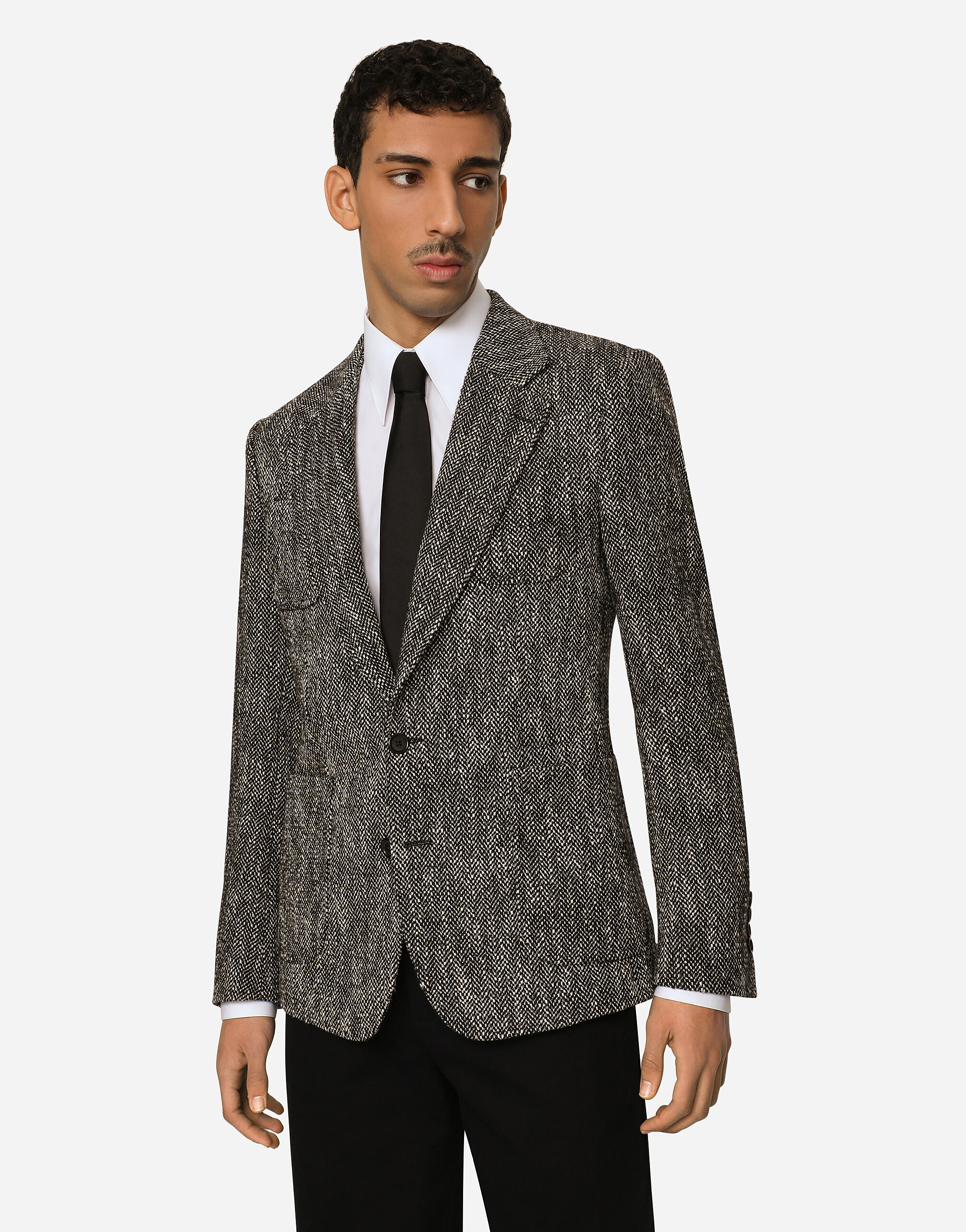 Single-breasted herringbone cotton and wool tweed jacket in