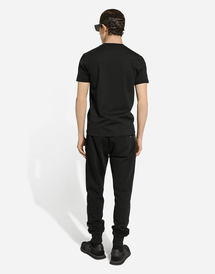 Dolce & Gabbana Pantalon de jogging en coton stretch à broderie DG Noir GP0F9ZG7N4R