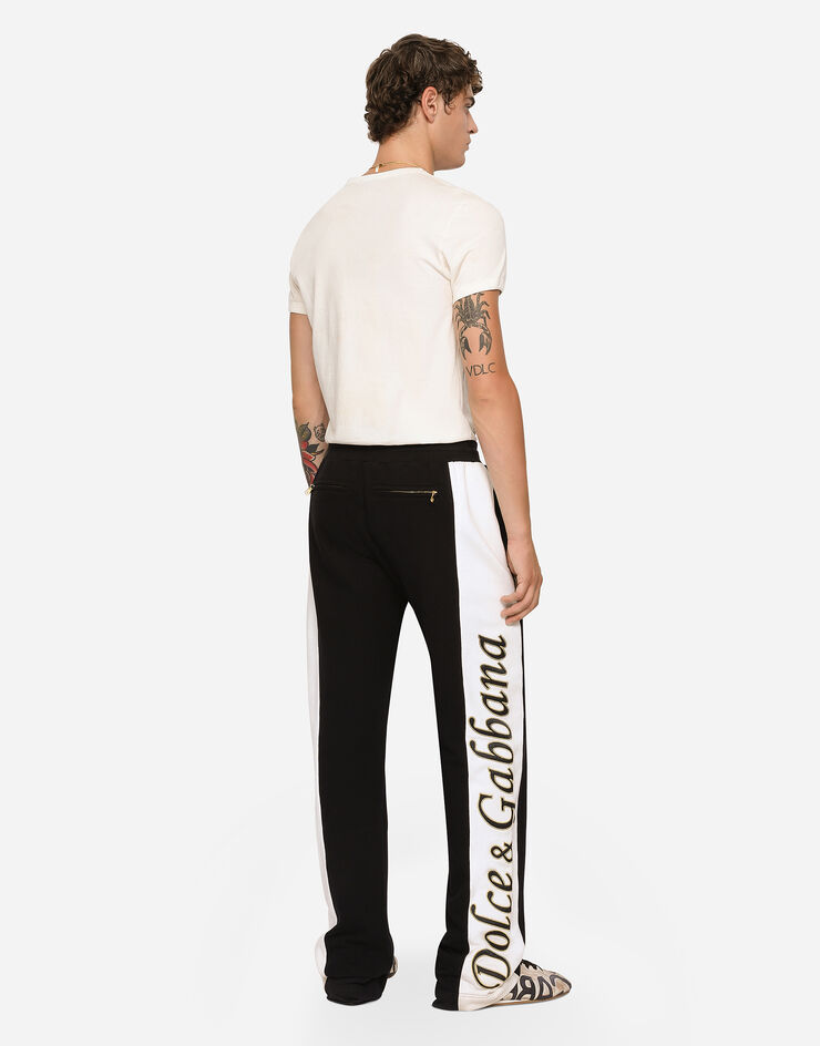 Pantaloni tuta neri con striscia bianca a fianco - Abbigliamento e  Accessori In vendita a Bergamo