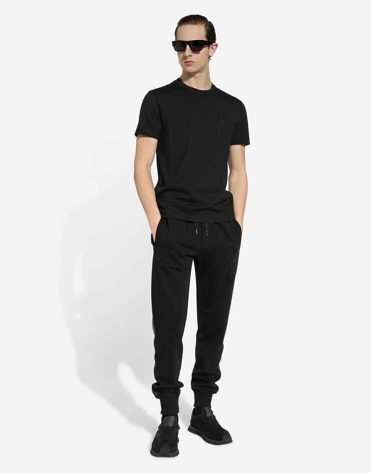 Dolce & Gabbana Pantalon de jogging en coton stretch à broderie DG Noir GP0F9ZG7N4R