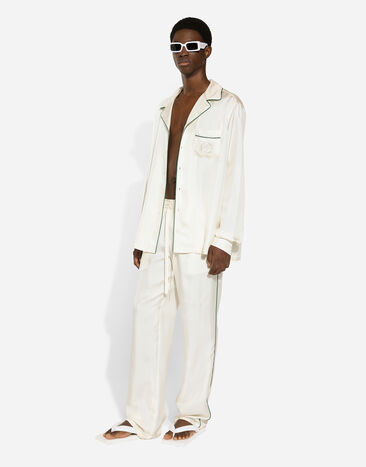 Dolce & Gabbana Спортивные брюки из шелка с вышивкой DG белый GVRMAZFU1S4