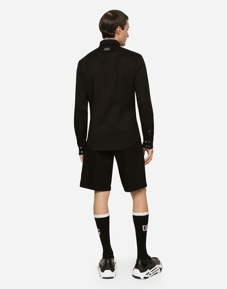Dolce & Gabbana شورت دنيم مرن أسود مغسول متعدد الألوان GWNXADG8GW6