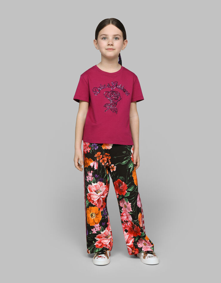 Dolce & Gabbana Pantaloni jogging in jersey con stampa fiori su base nera Stampa L5JPE9HS7O4