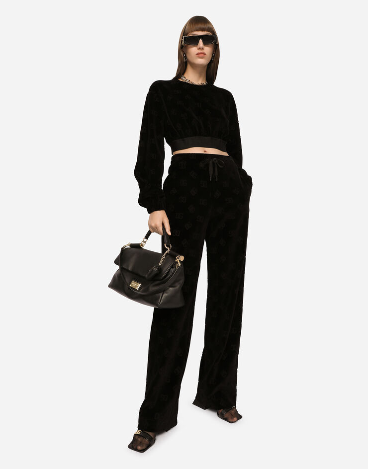 Flocked jersey pants with all-over US for Black logo DG | in Dolce&Gabbana®