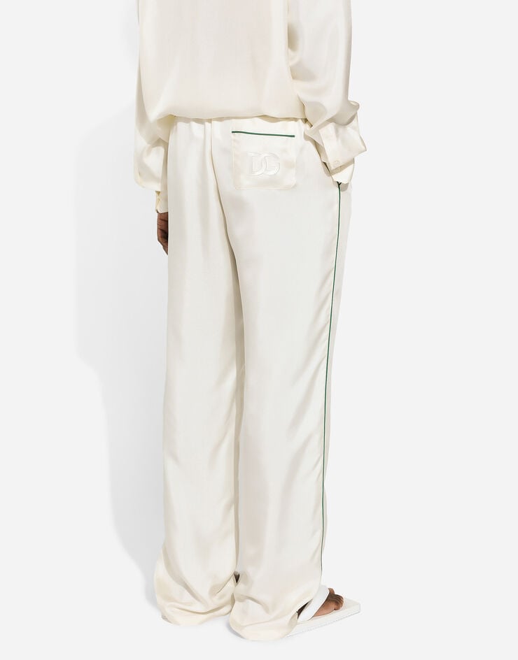 Dolce & Gabbana Pantalón estilo jogger de seda con DG bordado Blanco GVRMAZFU1S4