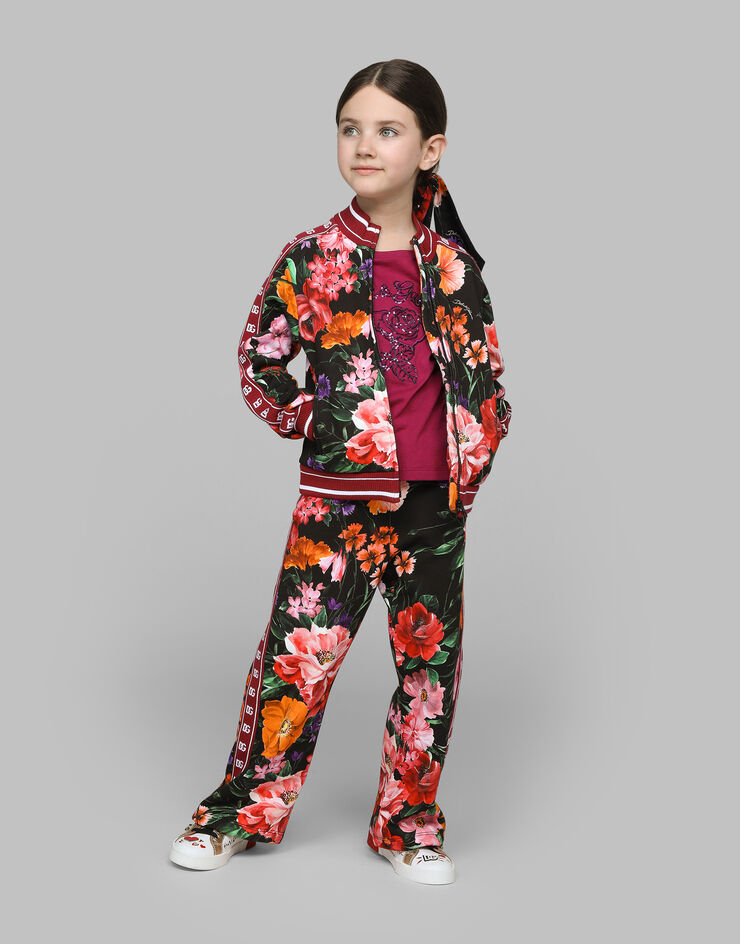 Dolce & Gabbana Jersey jogging pants with floral print over a black background Print L5JPE9HS7O4