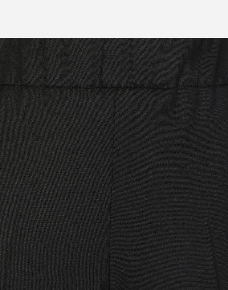 Dolce & Gabbana Pantalón acampanado en sarga de lana elástica Negro FTC51TFUBGC