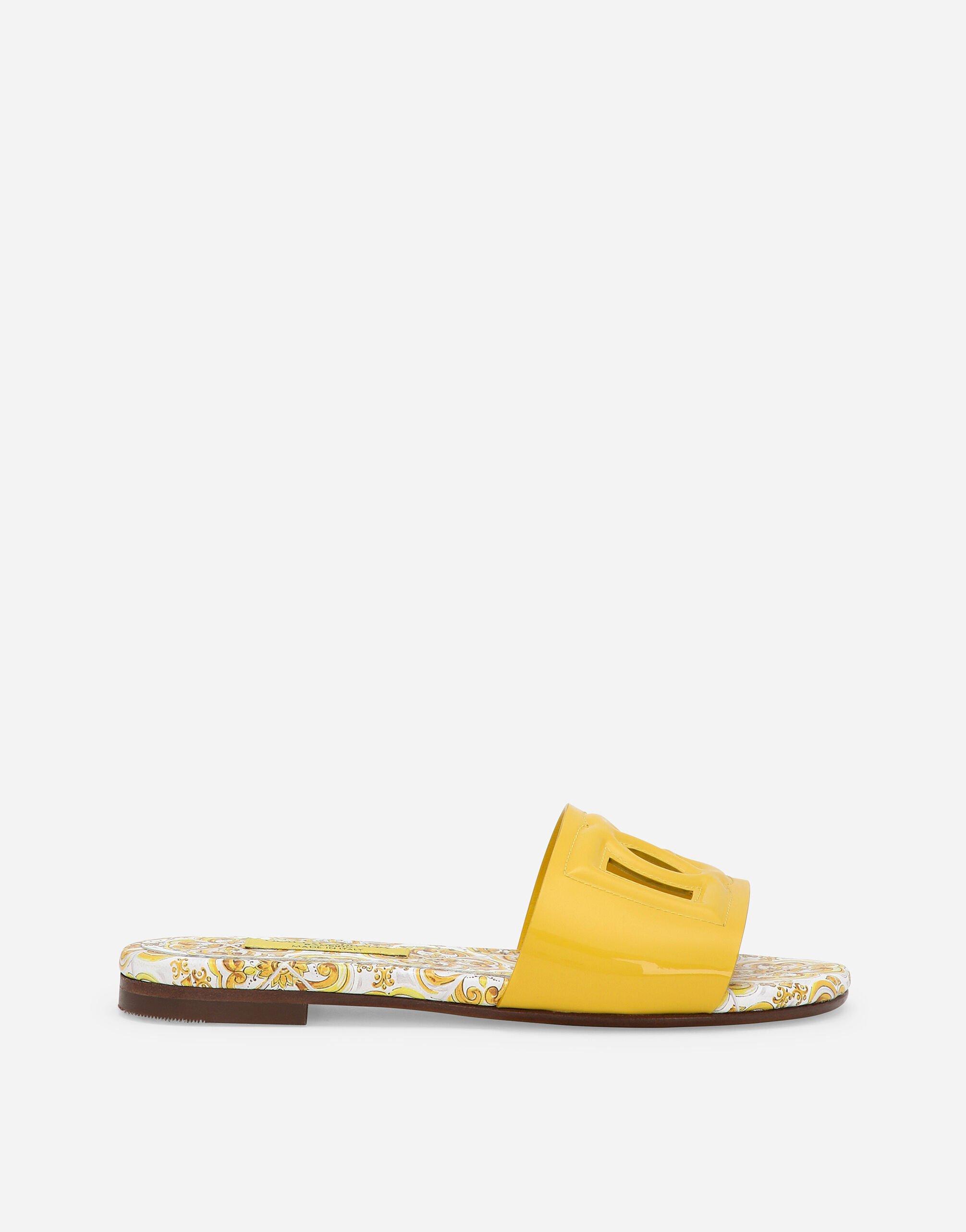 ${brand} Patent leather sliders with yellow majolica print and cut-out DG detail ${colorDescription} ${masterID}