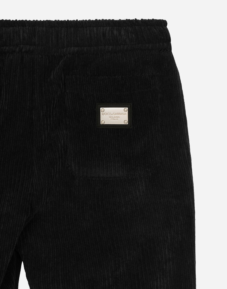 Dolce & Gabbana Pantalon en velours côtelé avec plaquette à logo Noir L44P65FUWDL