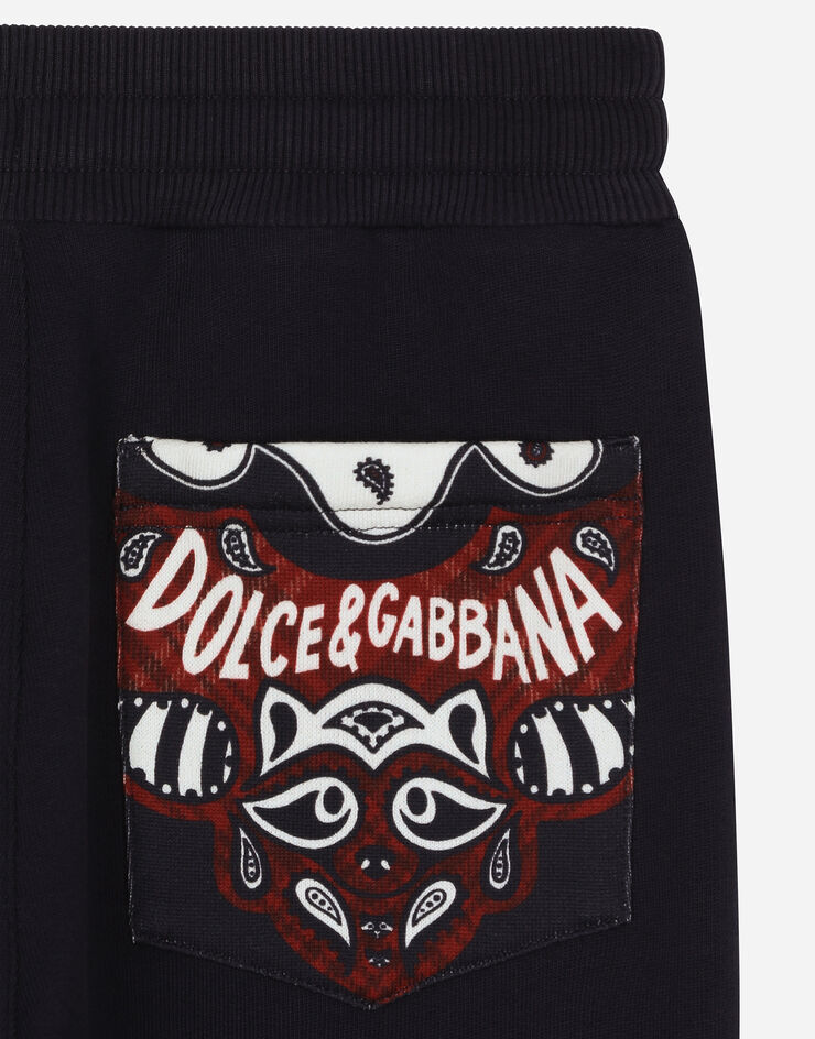 Dolce & Gabbana Pantalón de chándal en punto con detalles de estampado de bandana Azul L4JPJEG7NQN