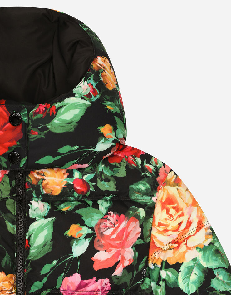 Dolce & Gabbana Long nylon down jacket with rose print over a black background Print L5JBQ5ISMIB