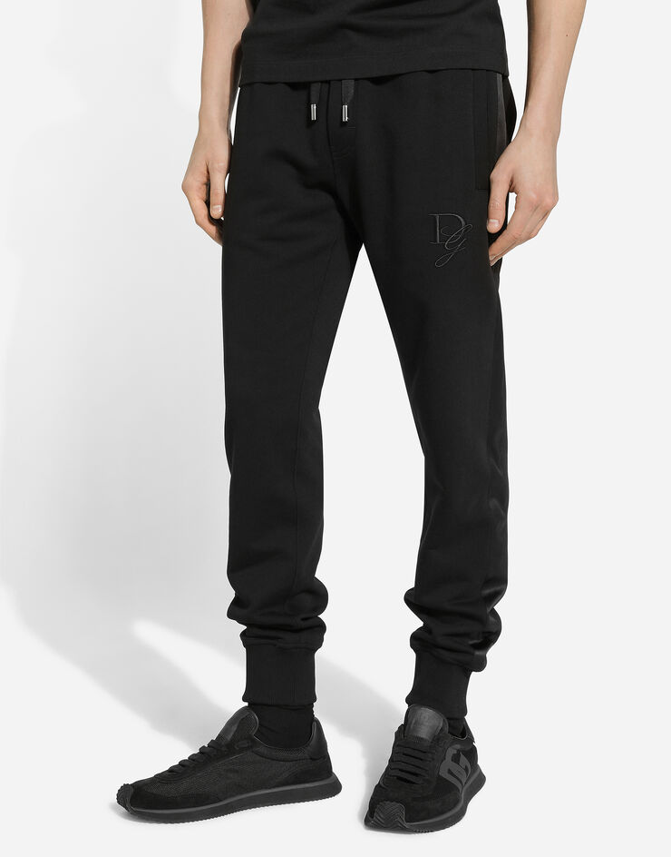 Dolce & Gabbana Pantalon de jogging en coton stretch à broderie DG Noir GP0F9ZG7N4R