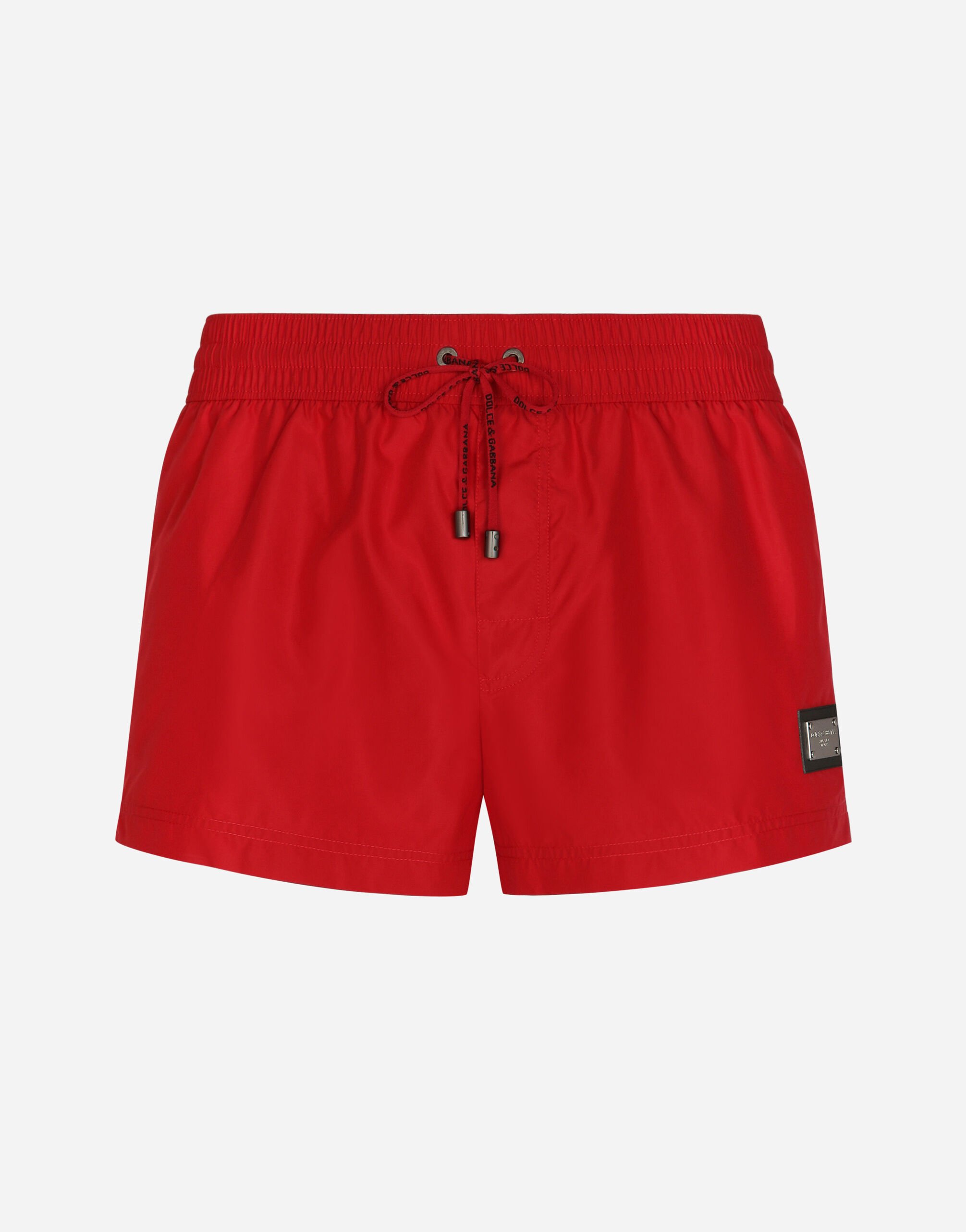 ${brand} Short swim trunks with branded tag ${colorDescription} ${masterID}
