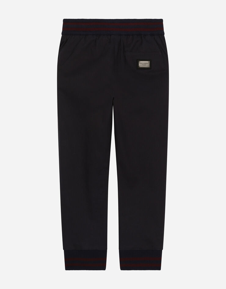 Dolce & Gabbana Pantalón de chándal de dril con placa con logotipo Azul L44P53FUFNH