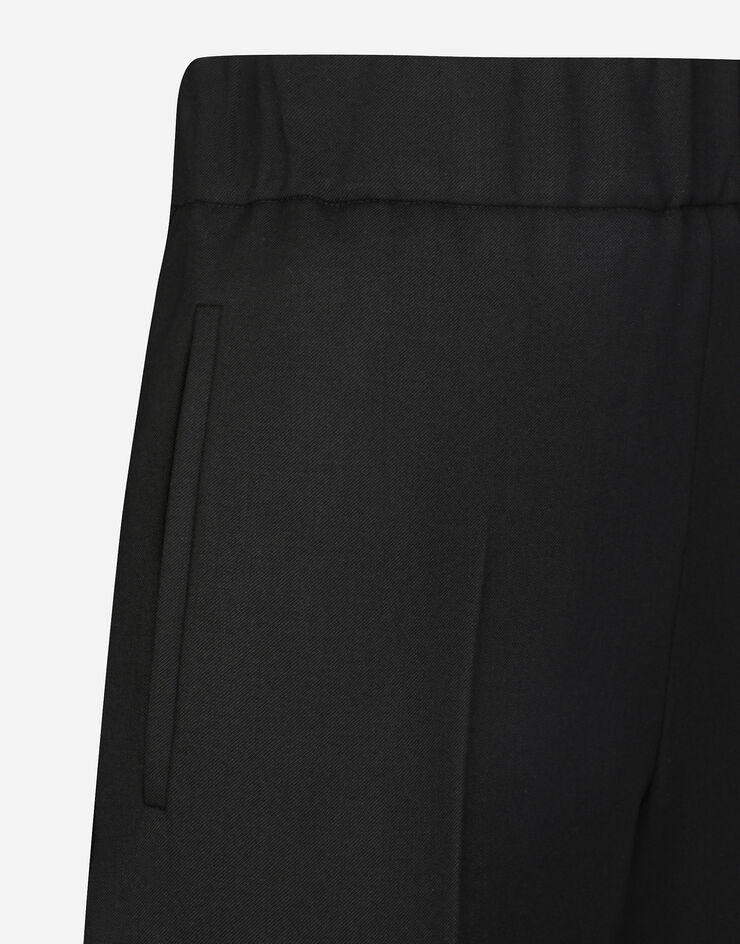 Dolce & Gabbana Ausgestellte Hose aus elastischem Wolltwill Schwarz FTC51TFUBGC