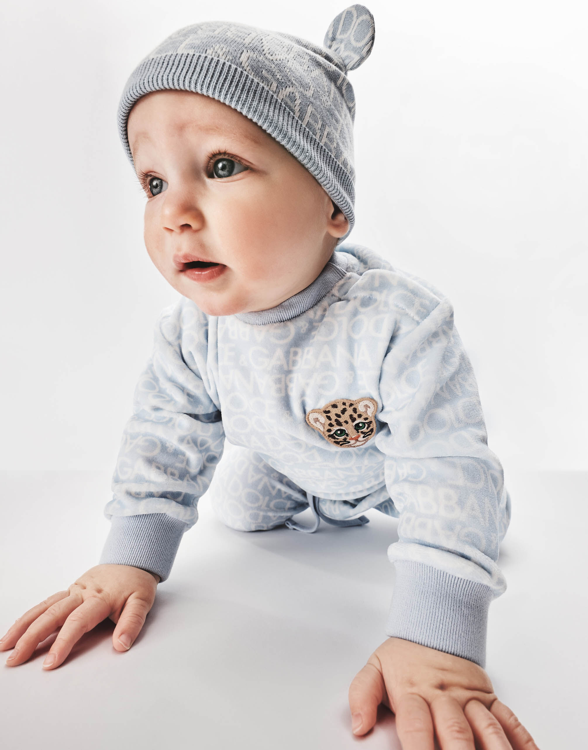 Long-sleeved jersey onesie with all-over logo print and patch