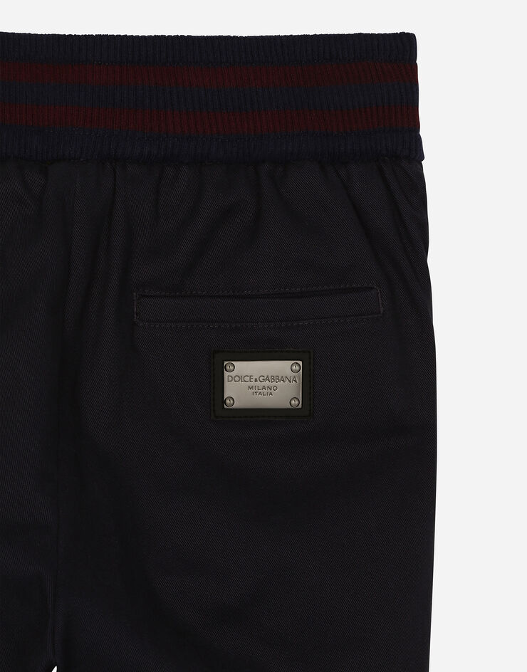 Dolce & Gabbana Pantalón de chándal de dril con placa con logotipo Azul L44P53FUFNH