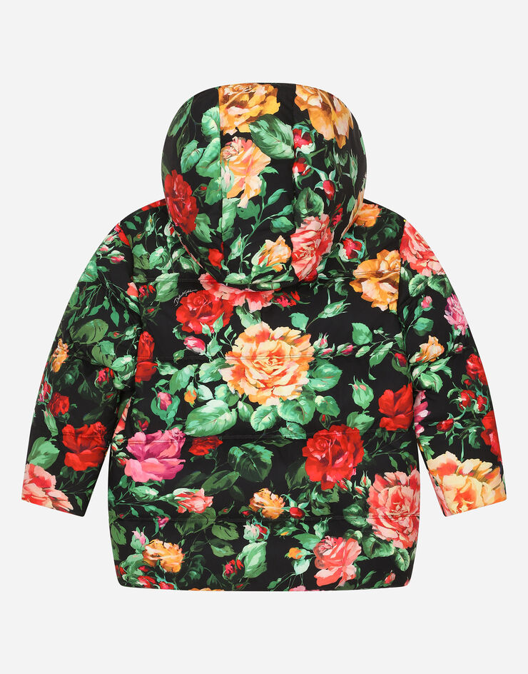 Dolce & Gabbana Long nylon down jacket with rose print over a black background Print L5JBQ5ISMIB