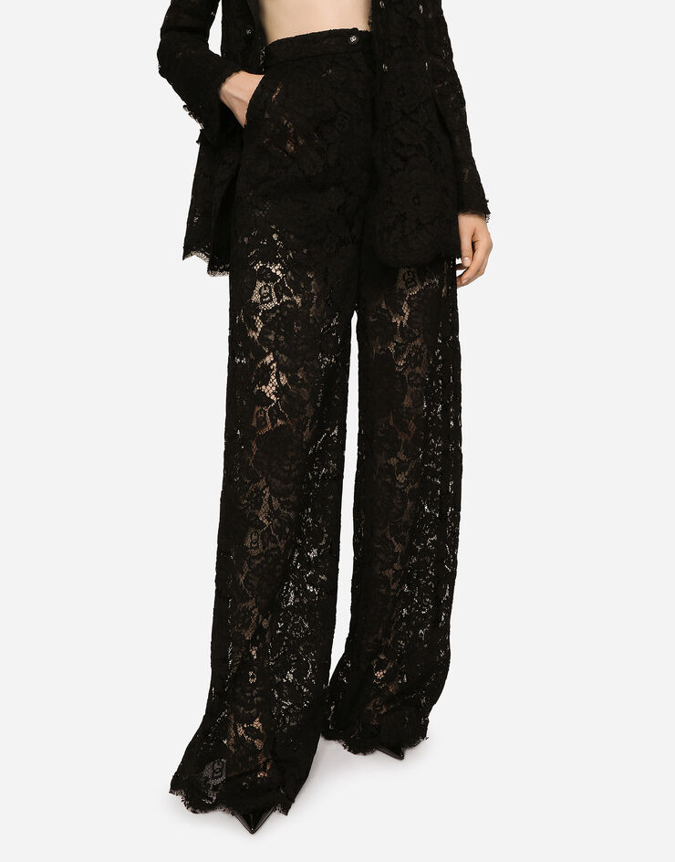 Flared branded stretch lace pants in Black for